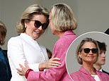 Belgium's Queen Mathilde sweetly greets King Albert II's love child Princess Delphine as they attend a Holy Mass held by Pope Francis in Brussels