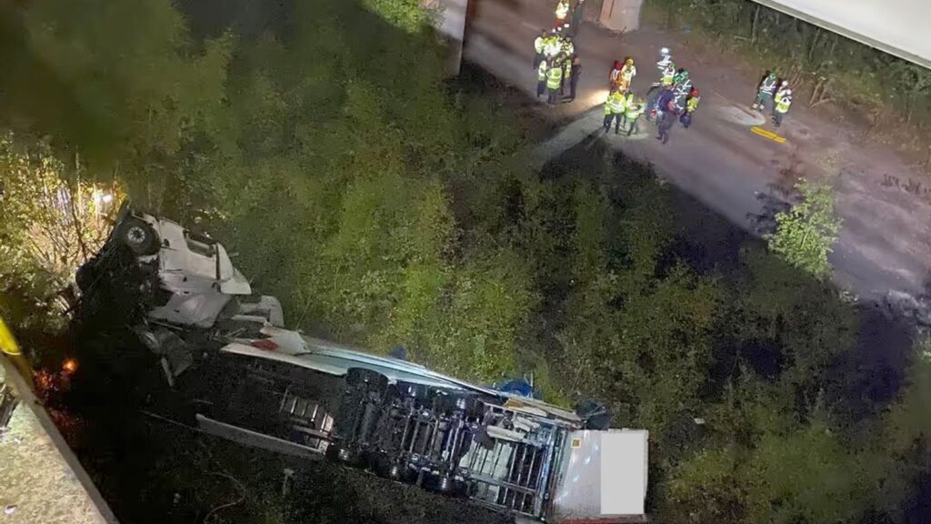 Cheshire Fire and Rescue Service handout photo of emergency services on the scene under a bridge on the M6 in Cheshire where a lorry fell 60 metres from the Thelwall Viaduct between junctions 20 and 21, landing on the embankment below. Issue date: Monday September 30, 2024. Cheshire Fire and Rescue Service/PA Wire