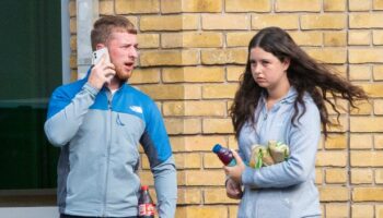 Couple who performed sex act on packed easyJet flight pictured outside court