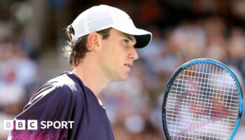 Britain's Jack Draper receives treatment for an abdominal injury before retiring midway through match against Carlos Alcaraz at Indian Wells