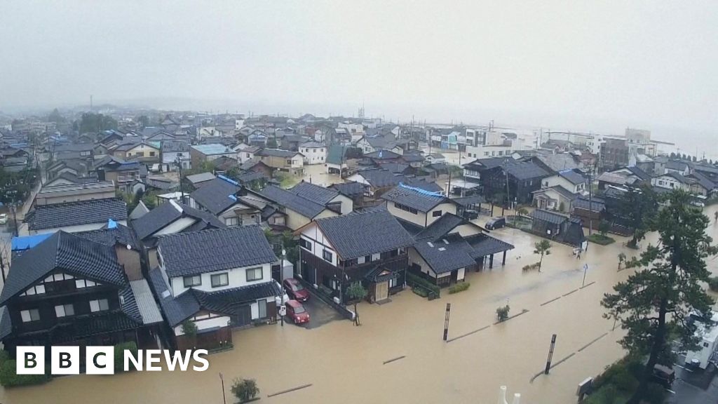 Japan orders mass evacuation over flooding threat