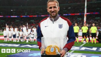 Harry Kane celebrates scoring on his England debut