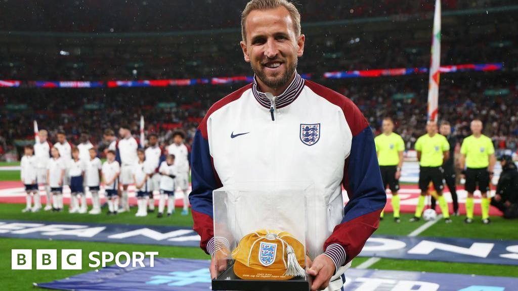 Harry Kane celebrates scoring on his England debut