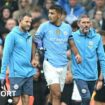 Rodri is helped from the pitch by Manchester City medical staff