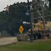 Moment freight train smashes into stranded 18-wheeler carrying military howitzer in 'devastating' collision