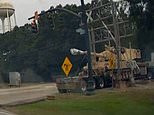 Moment freight train smashes into stranded 18-wheeler carrying military howitzer in 'devastating' collision