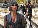 Naomi Campbell turns heads in a racy fishnet dress as she attends the Dolce & Gabbana show during Milan Fashion Week