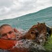 New footage shows dramatic moment sailor and his dog are rescued 20 miles off Florida coast after their boat sank in Hurricane Helene