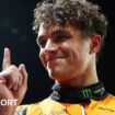 Lando Norris lifts his index finger in celebration after taking pole position for the Singapore Grand Prix