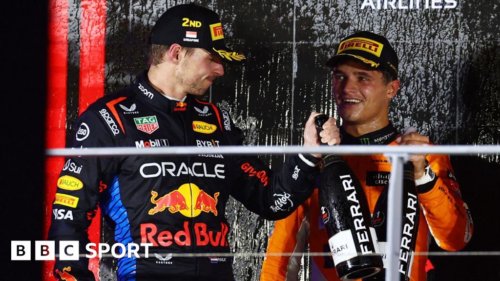 Max Verstappen congratulates Singapore Grand Prix winner Lando Norris on the podium