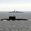 Royal Navy warship shadows Putin submarine in the English Channel as four Russian vessels enter UK waters amid increasing tensions over Ukraine and threat to 'sink' Britain