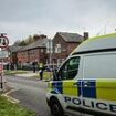 Schoolgirl, eight, and woman, 40, found dead inside Salford home as police probe deaths after getting 'concern for welfare' call