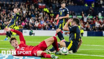 Scotland's Grant Hanley concedes a penalty against Poland