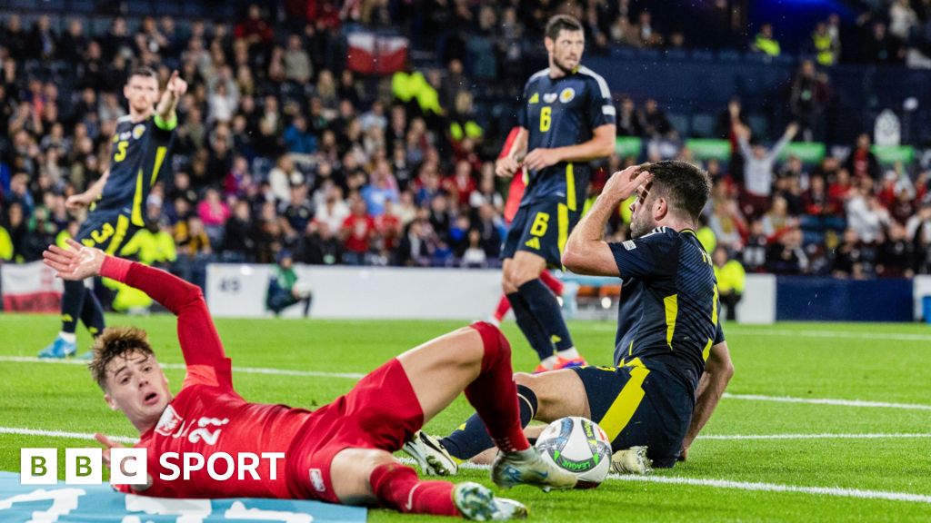 Scotland's Grant Hanley concedes a penalty against Poland