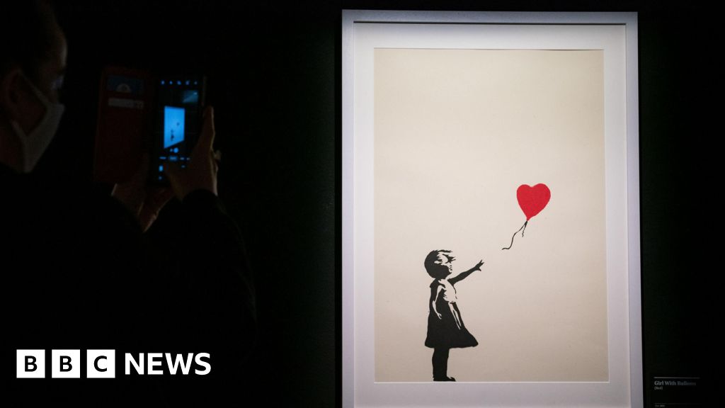 Two men charged over stolen Banksy artwork