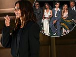 Victoria Beckham receives a rousing reception from her star-studded audience during her Paris Fashion Week show as the Beckham family beam with pride in the front row