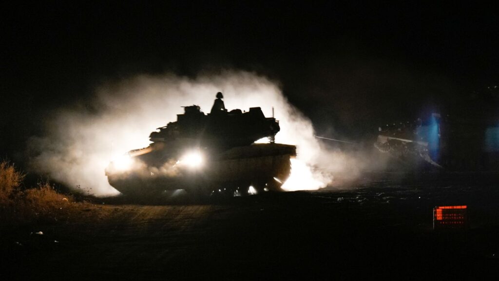 An Israeli tank manoeuvres near the Israel-Lebanon border Pic: AP