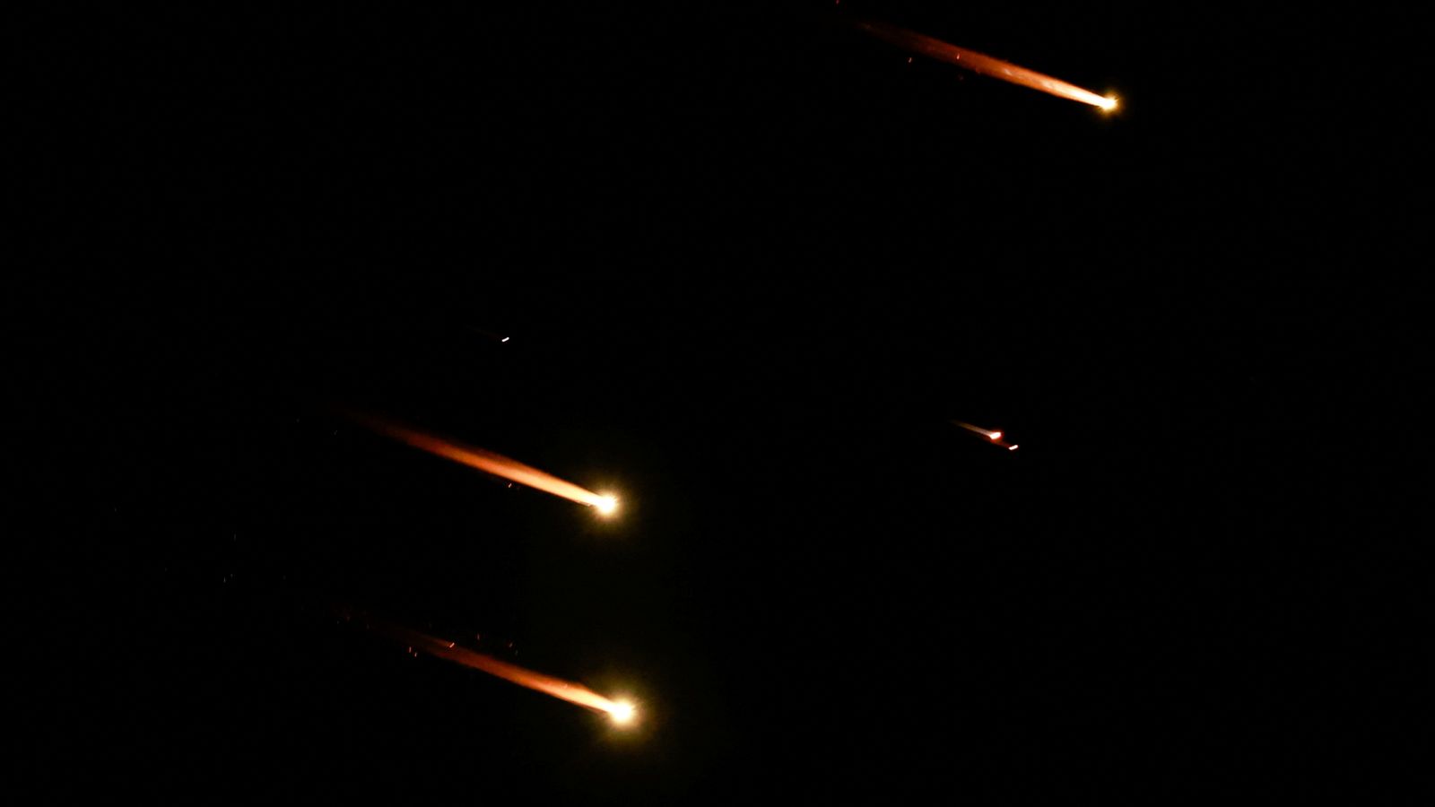 Rockets fly in the sky, amid cross-border hostilities between Hezbollah and Israel, as seen from Tel Aviv, Israel, October 1, 2024. REUTERS/Ammar Awad