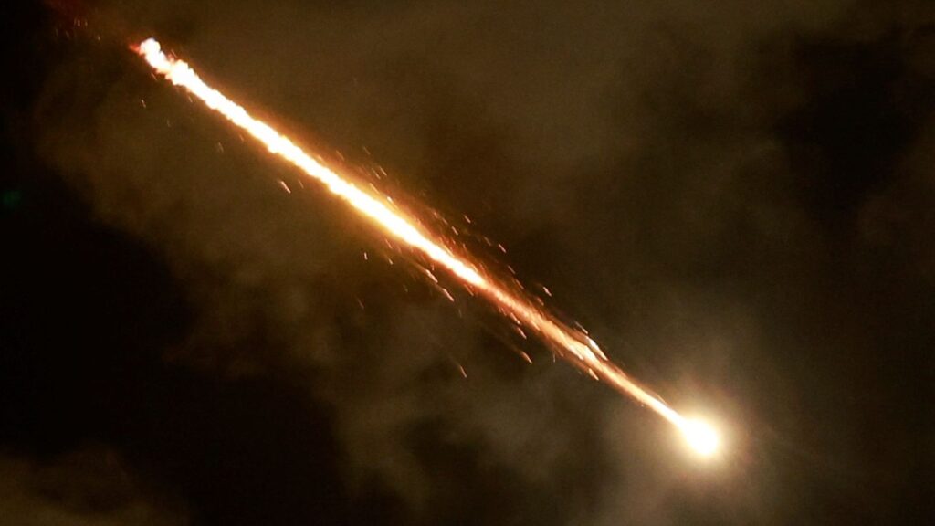 A rocket flies in the sky, amid cross-border hostilities between Hezbollah and Israel, as seen from Tel Aviv, Israel. Pic: Reuters