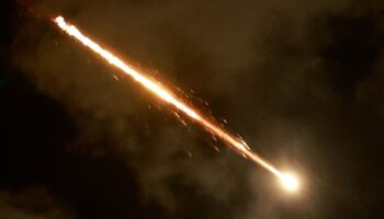 A rocket flies in the sky, amid cross-border hostilities between Hezbollah and Israel, as seen from Tel Aviv, Israel. Pic: Reuters