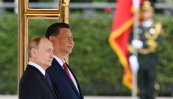 In this pool photograph distributed by the Russian state agency Sputnik, Russia's President Vladimir Putin and China's President Xi Jinping attend an official welcoming ceremony in front of the Great Hall of the People in Tiananmen Square in Beijing on May 16, 2024. (Photo by Sergei BOBYLYOV / POOL / AFP) / ** Editor's note : this image is distributed by Russian state owned agency Sputnik **