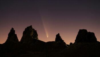 Comet Tsuchinshan-ATLAS, C/2023, with an 80,000 year orbit, passes behind geological formations, tufa spires at Trona Pinnacles, California, U.S. October 12, 2024.  REUTERS/David Swanson TPX IMAGES OF THE DAY