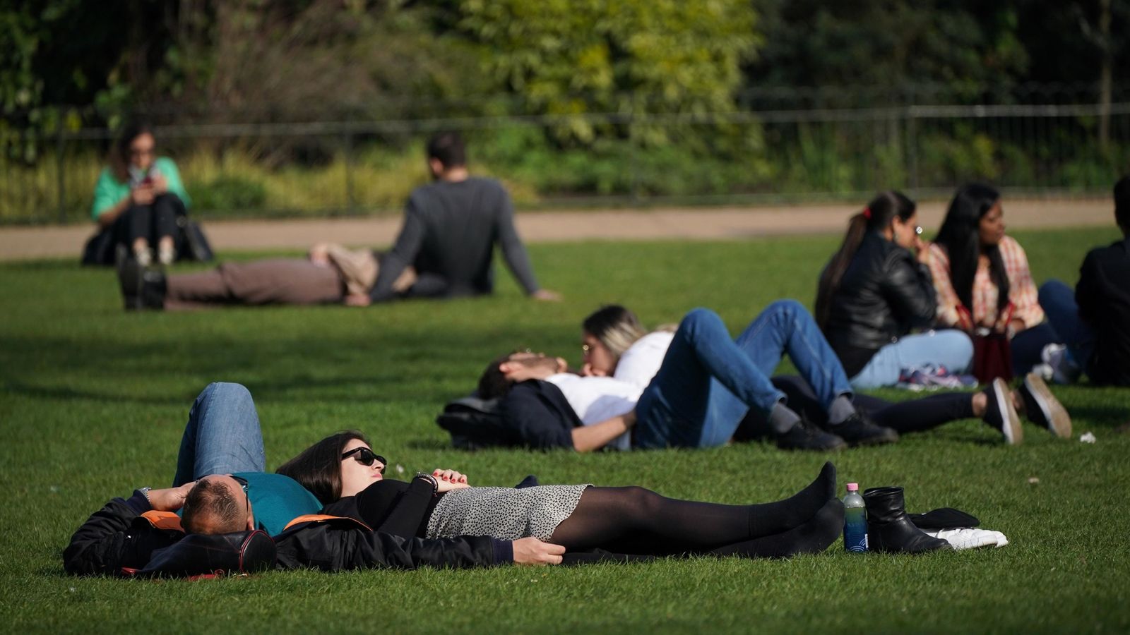 People enjoying the afternoon sun in St James's Park in London. Pic: PA