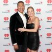 TJ Holmes ends Chicago Marathon in an ambulance after injury running alongside Amy Robach