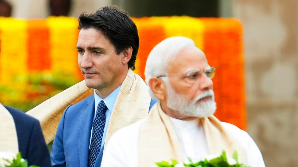 Canada's Prime Minister Justin Trudeau walks past Indian counterpart Narendra Modi in New Delhi in September 2023. Pic: AP