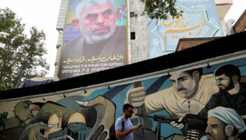 A billboard with a picture of newly appointed Hamas leader Yahya Sinwar is displayed on a building in a street in Tehran, Iran, August 12, 2024. Majid Asgaripour/WANA (West Asia News Agency) via REUTERS  ATTENTION EDITORS - THIS PICTURE WAS PROVIDED BY A THIRD PARTY