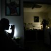 FILE PHOTO: A man drinks water at his home during a power outage caused by breakdowns forcing six plants to go off-line on the grid, according to the state run power company, in Matanzas, Cuba August 22, 2024. REUTERS/Norlys Perez/File Photo