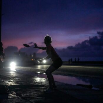 With little else to do during the blackout, residents played frisbee in Havana. Pic: AP