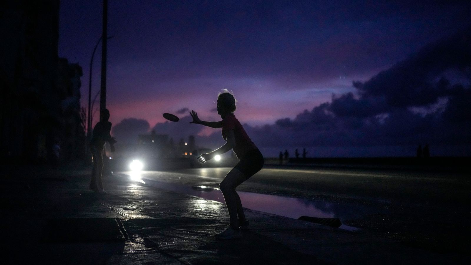 With little else to do during the blackout, residents played frisbee in Havana. Pic: AP