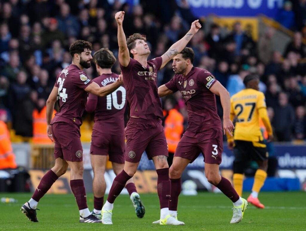 John Stones strikes late as Man City beat Wolves with controversial goal