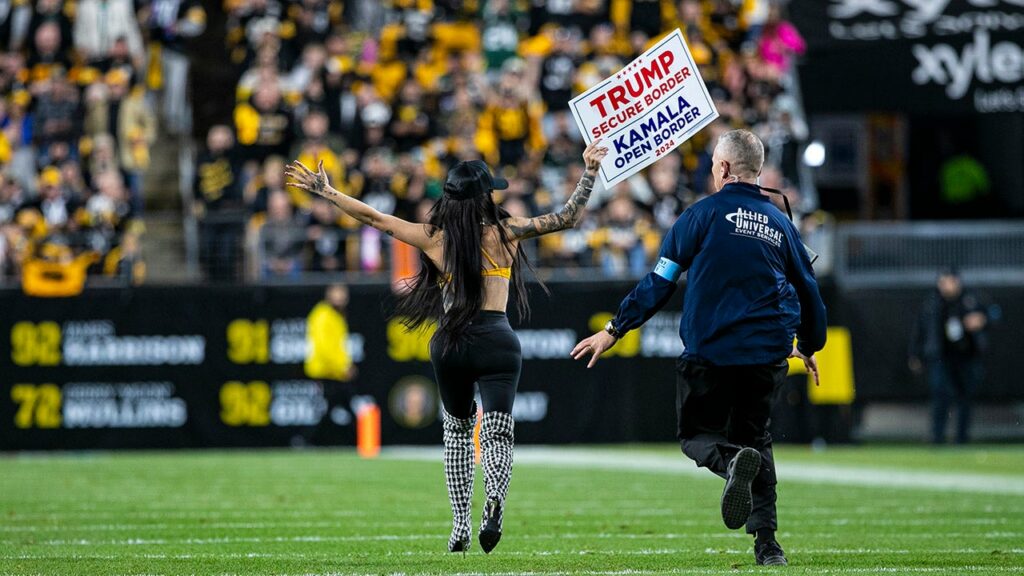 Woman runs onto Steelers' field with pro-Trump sign as former president attends game