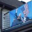 A flag depicting the attempted assassination of Trump at a Michigan home