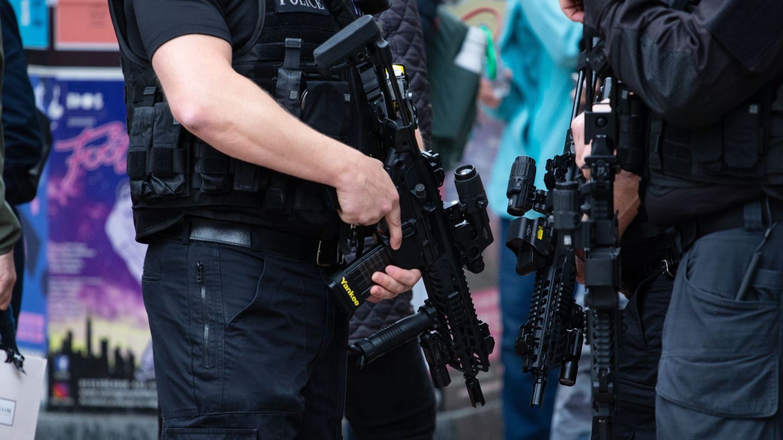 leeds, United Kingdom – May 05, 2019: Horizontal shot of armed police patrolling tour de yorkshire crowd to keep everyone safe