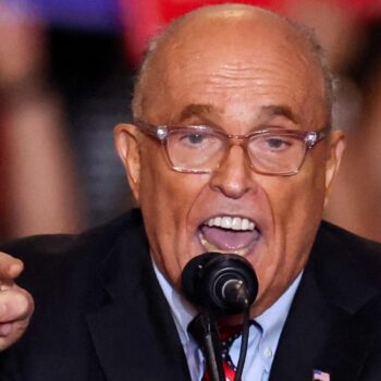 FILE PHOTO: Former mayor of New York City and former Trump lawyer Rudy Giuliani speaks at the Nassau Veterans Memorial Coliseum during a rally held by Republican presidential nominees and former U.S. President Donald Trump, in Uniondale, New York, U.S., September 18, 2024. REUTERS/Brendan McDermid/File Photo