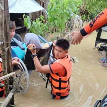 Philippine Coast Guard personnel rescue residents in Bicol, Philippines. Pic: Reuters