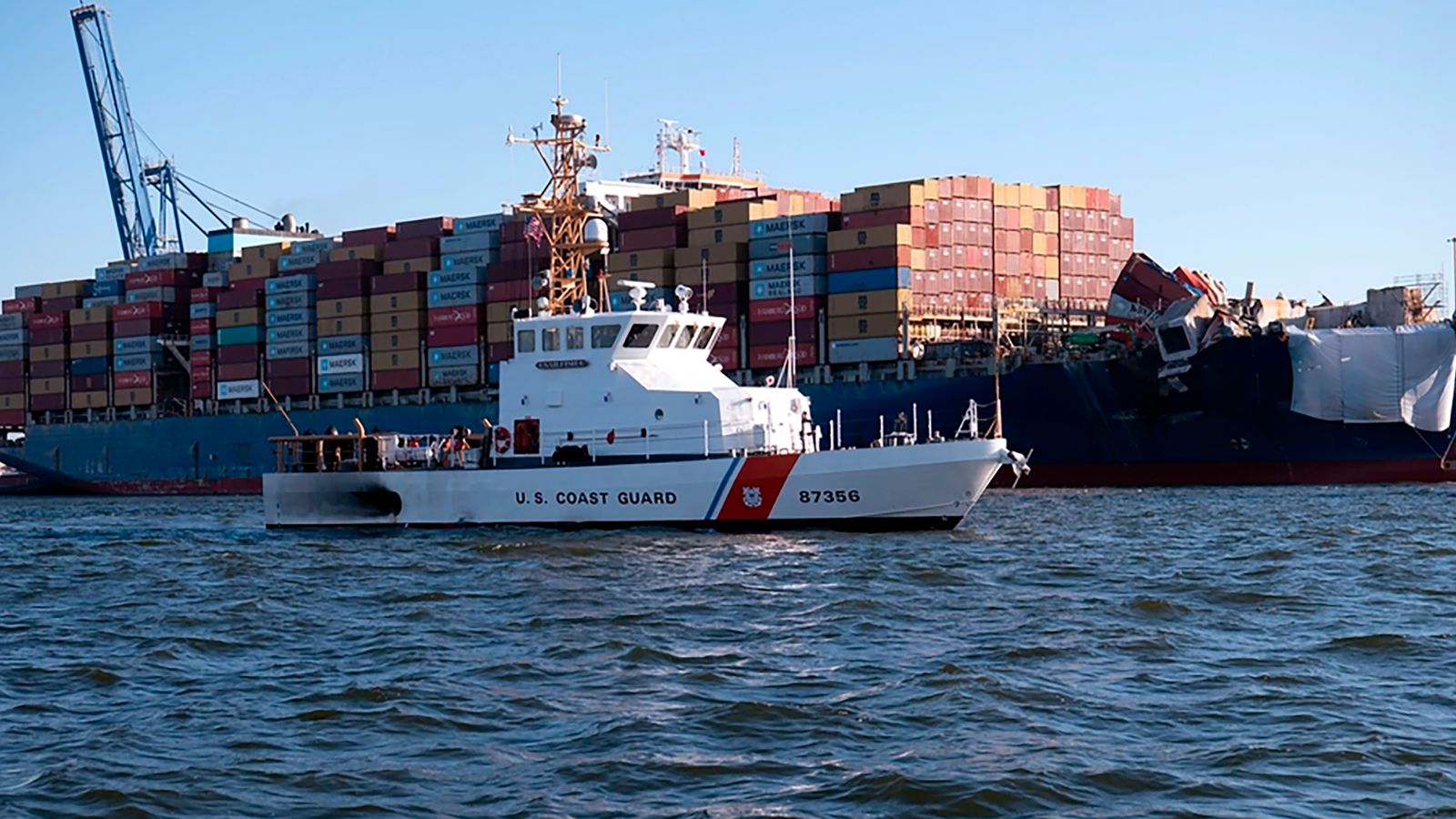 This image provided by the U.S. Coast Guard shows the U.S. Coast Guard Cutter Sailfish, an 87-foot Marine Protector class vessel, as it prepares to escort the Motor Vessel Dali during its transit from the Port of Baltimore to the Port of Virginia, Monday, June 24, 2024. (Petty Officer 3rd Class Christopher Bokum/U.S. Coast Guard via AP)