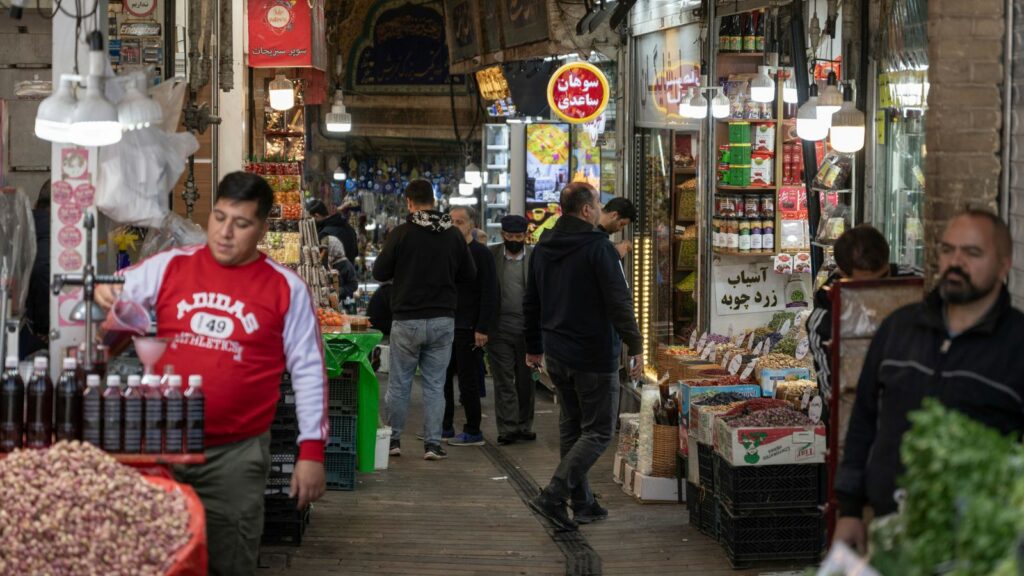 People go about their daily lives after the Israeli retaliatory strike in Iran. The airstrike has left many of the country's inhabitants undaunted. Pic: AP