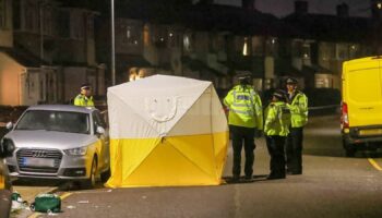 A crime scene tent erected in First Avenue, Dagenham, after a woman and two girls were stabbed. Pic: UKNIP