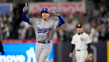 Los Angeles Dodgers hang on late to clinch third win of World Series