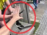 Amazing moment parkour runner 'steals' six phones worth £4,500 in just 40 seconds to show how easy it is for thieves to grab your mobile