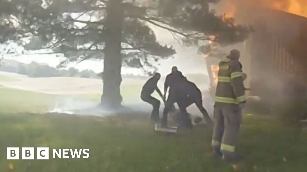 Bodycam captures rescue of woman in basement of burning house