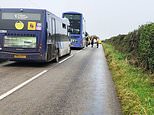 Child and woman in her 30s fighting for their lives after a double-decker school bus crash in Cornwall: Four other children injured in smash