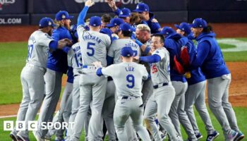 Los Angeles Dodgers players celebrate after winning the World Series