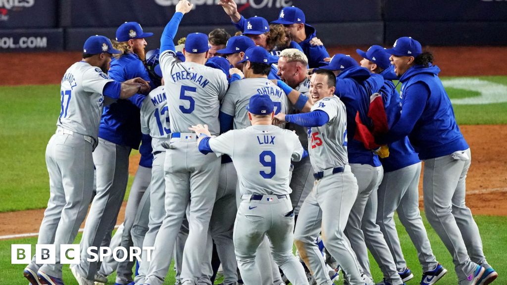 Los Angeles Dodgers players celebrate after winning the World Series