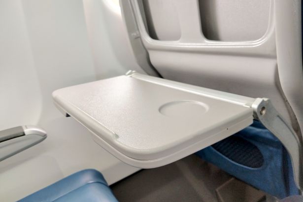 'I'm a flight attendant and this is why you should always avoid eating off tray tables on planes'