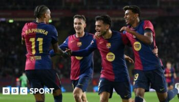 Barcelona players celebrate a goal